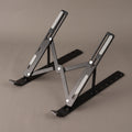 Adjustable laptop stand opened to a middle locking height