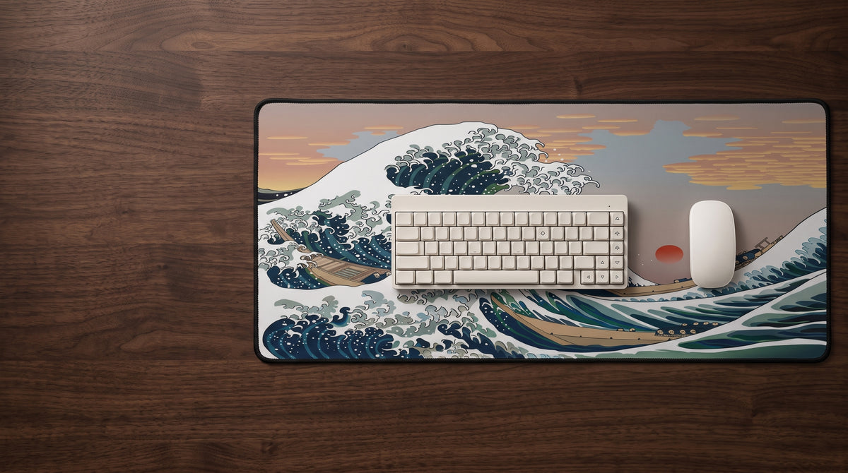 Great Wave desk mat on a dark desk with a keyboard and mouse