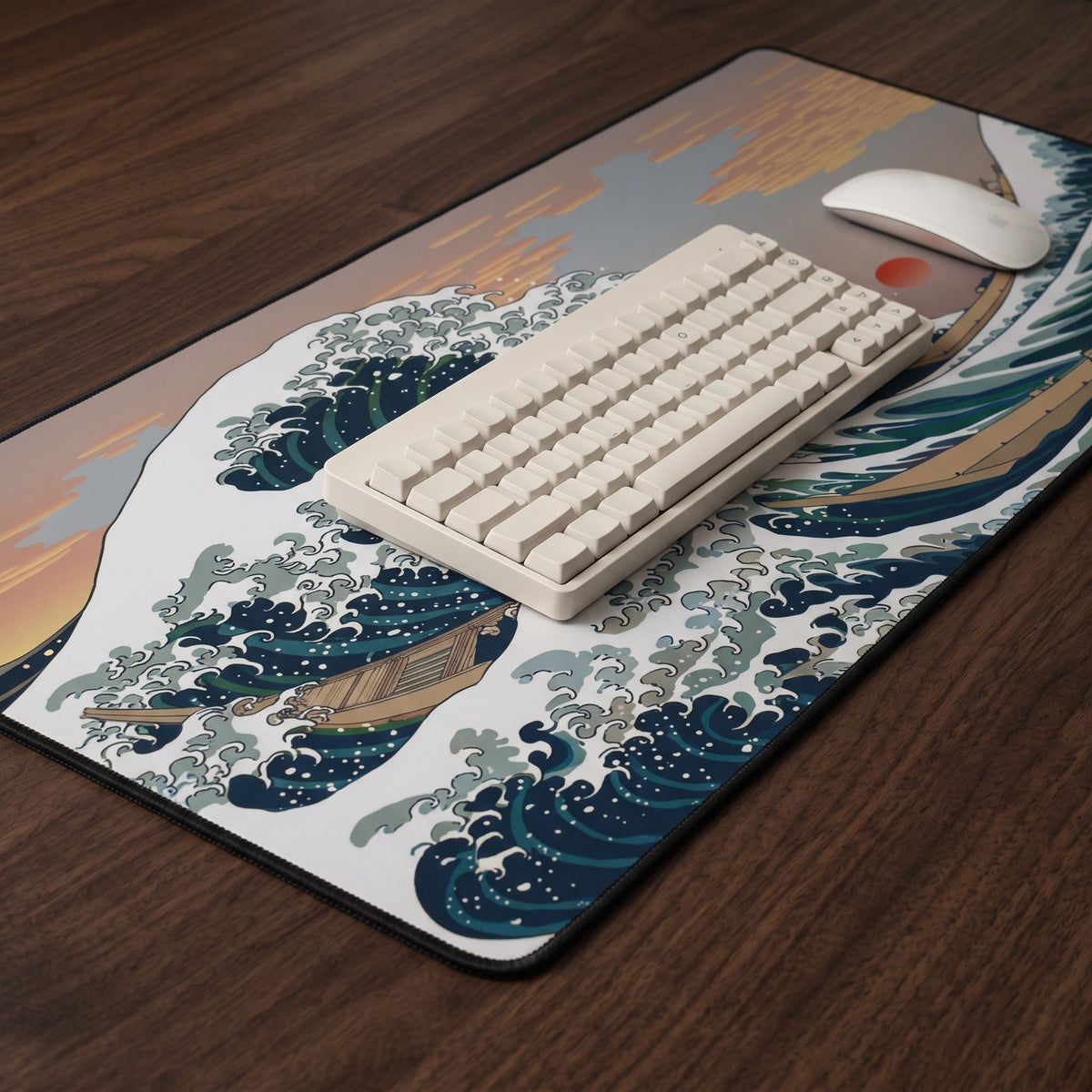 Great Wave desk mat on a walnut desk with a keyboard, showing the stitched edge