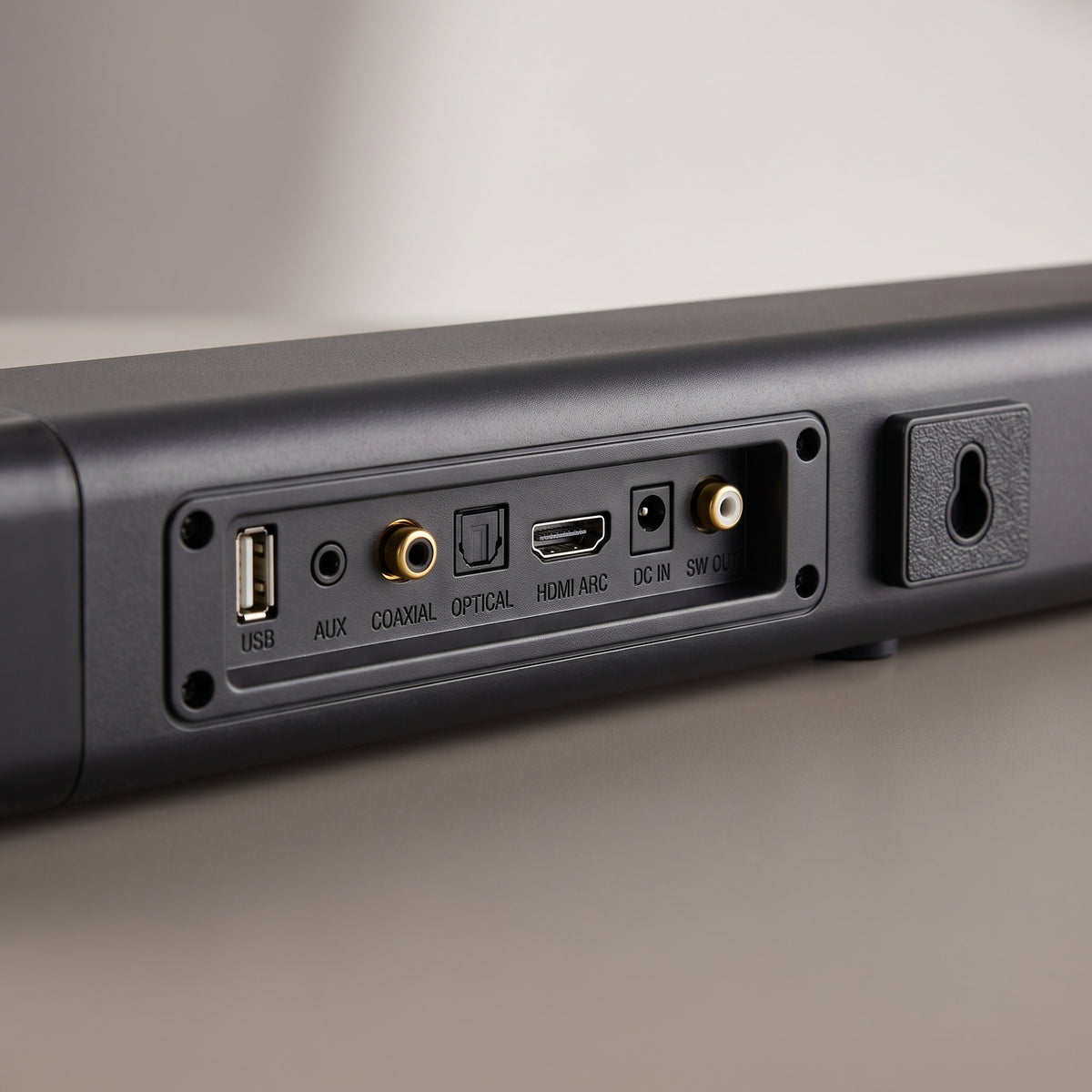 Close-up of the stereo TV soundbar's rear panel with optical, HDMI ARC, AUX and USB inputs