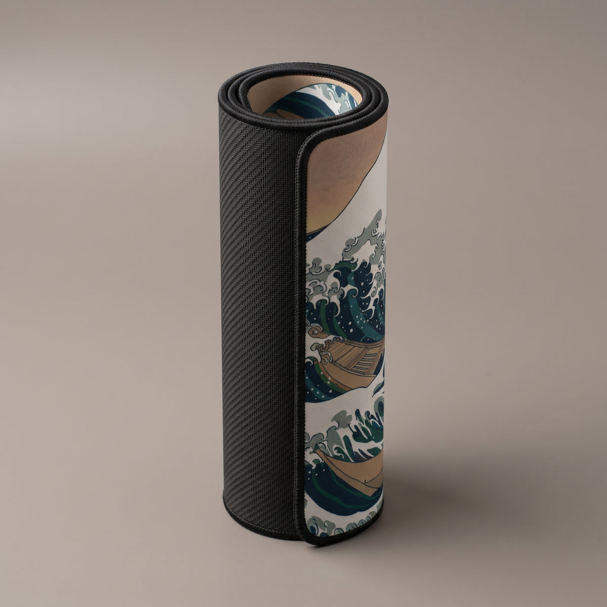 Great Wave desk mat rolled up