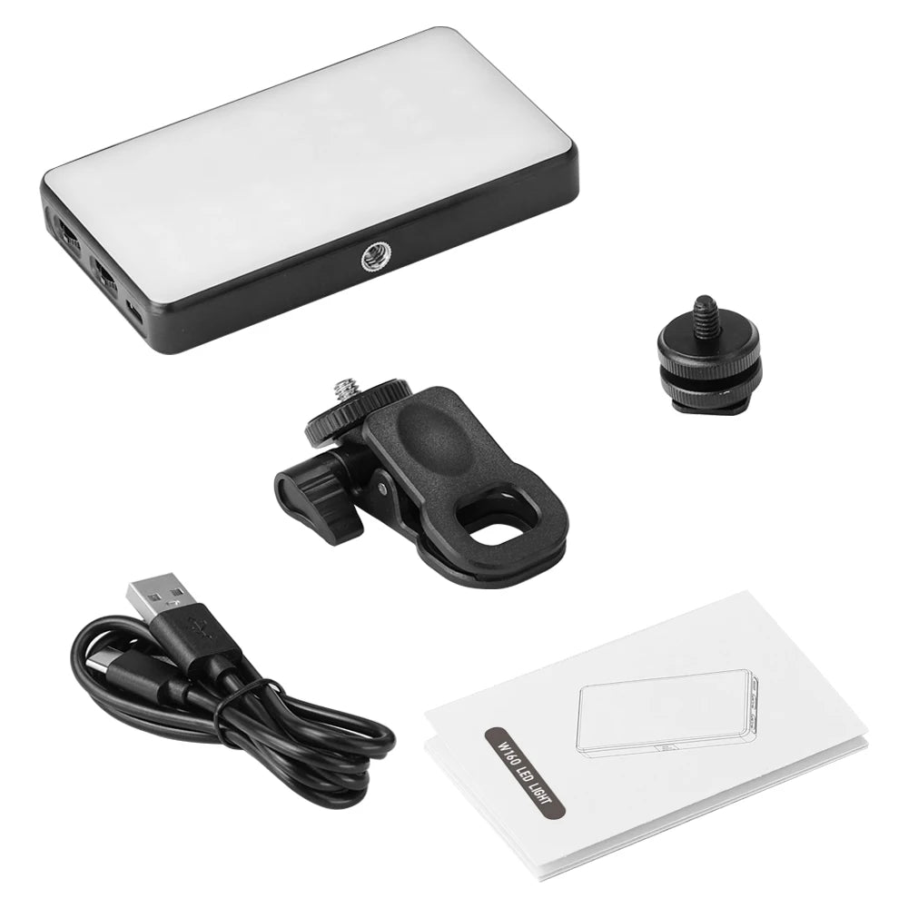 Clip-on video call light shown with its clip mount, cold-shoe adapter, USB cable and manual