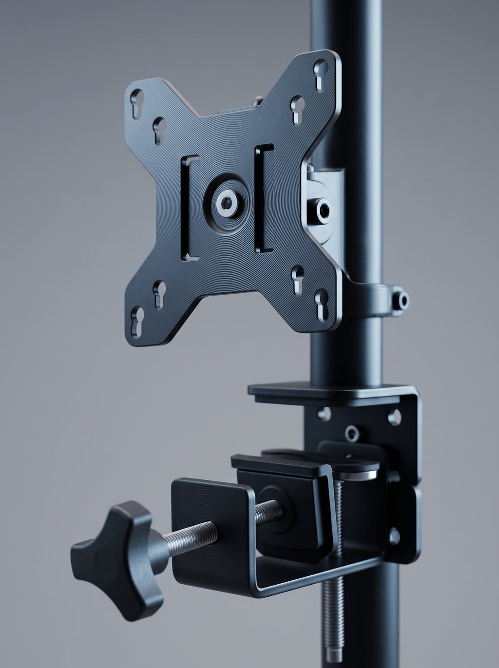 Monitor arm with laptop tray, close-up of the VESA head and clamp hardware