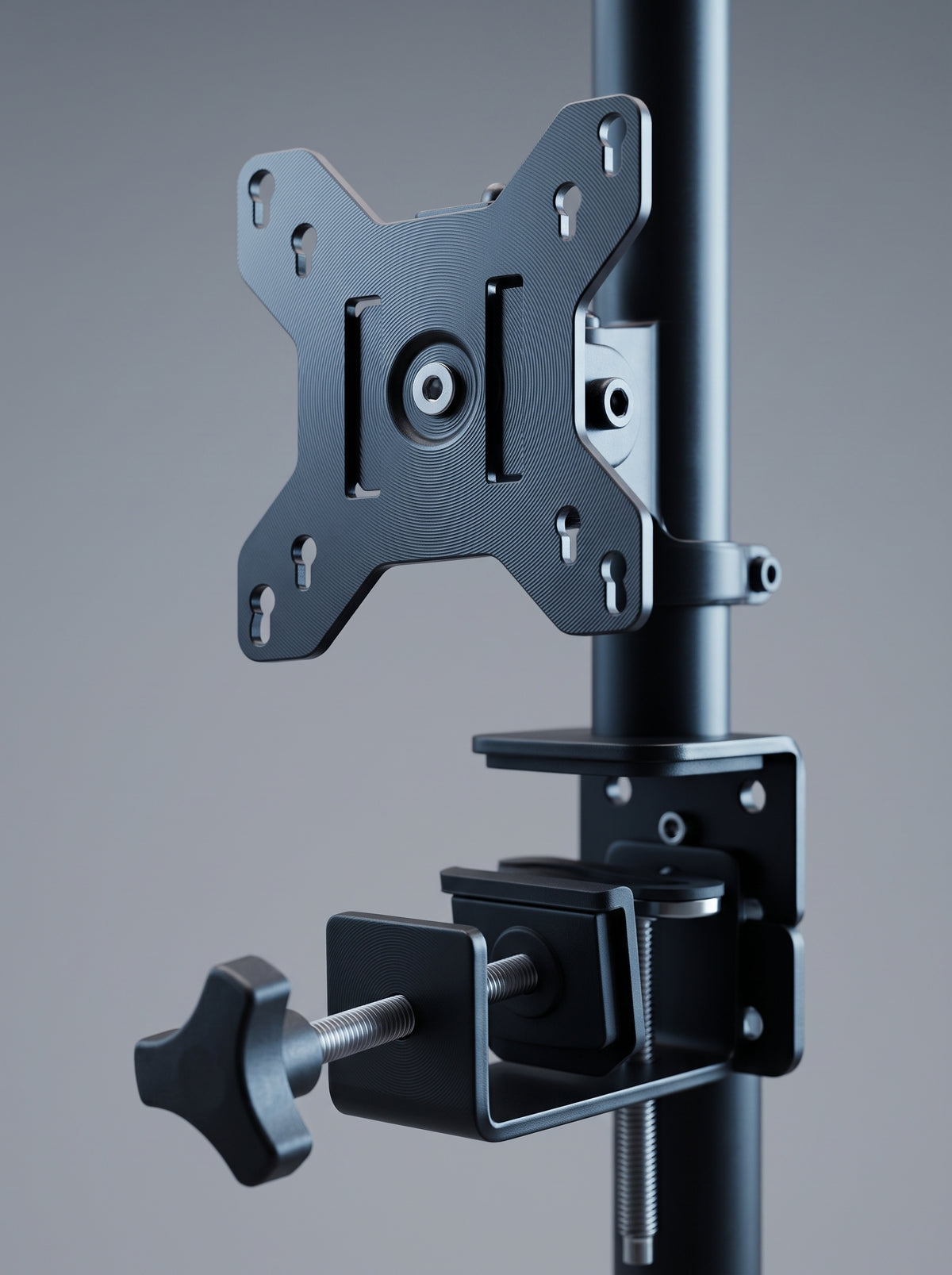 Monitor arm with laptop tray, close-up of the VESA head and clamp hardware